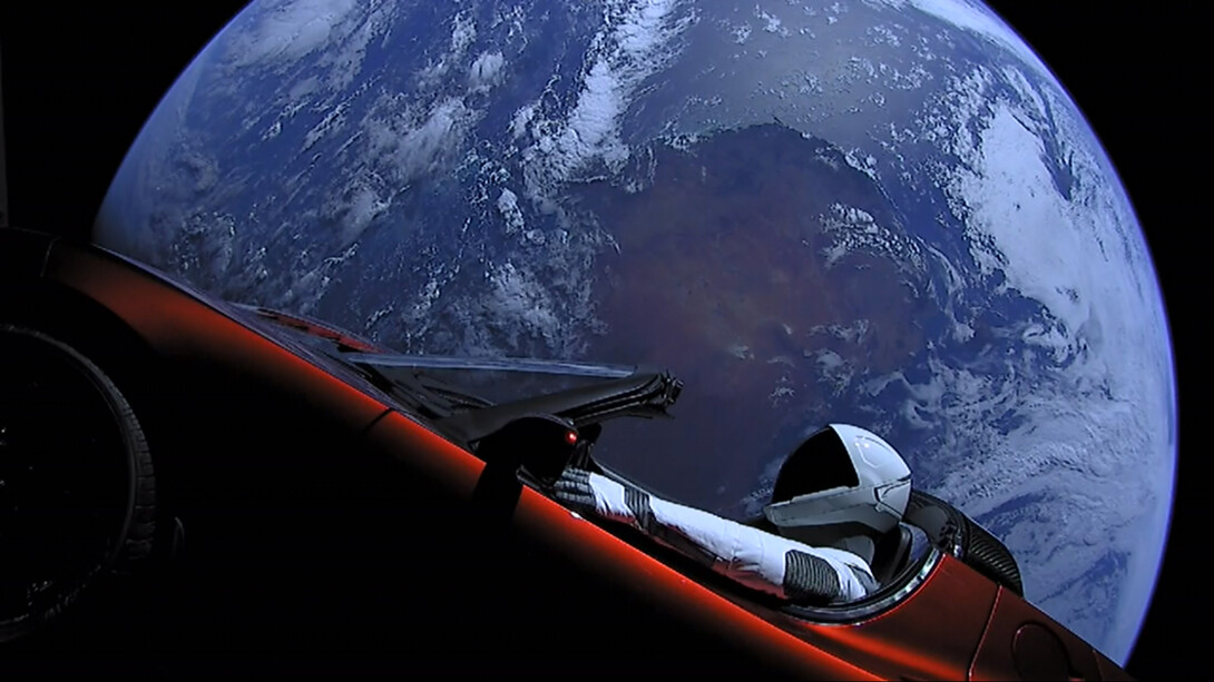 An astronaut riding a Tesla Roadster in space, the Earth serving as background