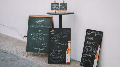 Outdoor café menu display, inviting customers with its selection of dishes and showcasing the café’s offerings