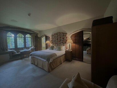 Homemade biscuits and mineral water greet guests in their stylish and cozy room at Amberley Castle located in West Sussex, UK
