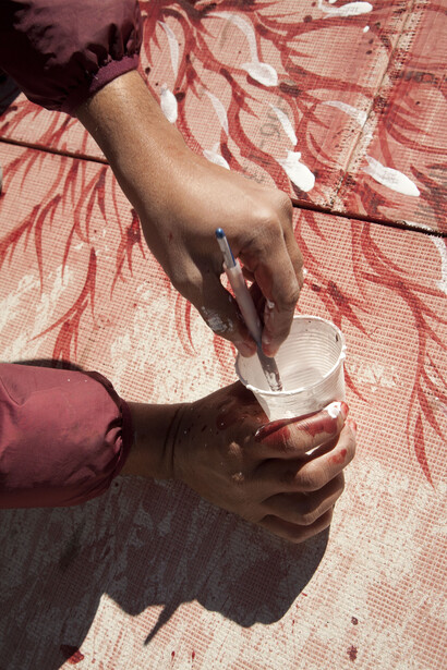   Imran Qureshi paints the roof of the Tower
