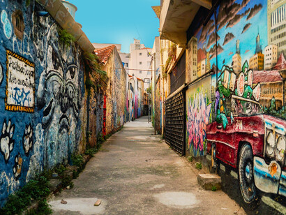 A vibrant alleyway filled with urban street art murals