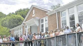 Previous students and teachers celebrate a school reunion and stand in front of what was once Carnegie High School in Marion, Virginia, USA. This school was an important site for the Black community in Smyth County