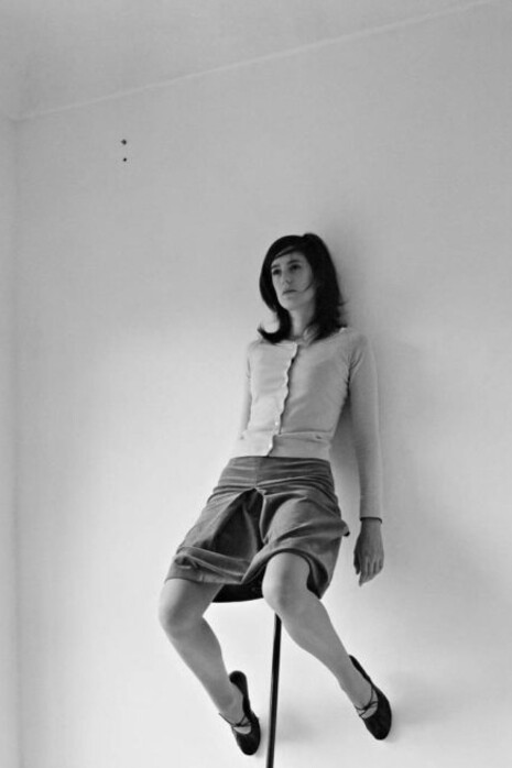 Erwin Wurm's "One Minute Sculptures" is an ongoing (1997- ) series of conceptual artworks where the artist or his models (and often even the public) interact with everyday objects in spontaneous, unusual, and often humorous ways for a brief period – typically sixty seconds or less. By using the human body and mundane objects in unconventional poses, Wurm pushes the boundaries of what constitutes sculpture, inviting viewers to reconsider the traditional notion of plastic, static, permanent form. Photo: Erwin Wurm – One Minute Sculpture, Freud’s rectification (Philosophy digestion) 2004