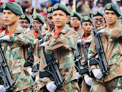 The precision and discipline of the South African National Defense Force shine through as they march in perfect formation during the parade, showcasing their commitment to national duty