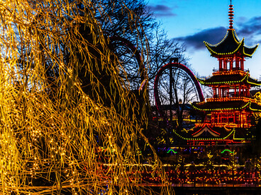 Tivoli Gardens, commonly known as Tivoli, is a historic amusement park and pleasure garden located in Copenhagen, Denmark