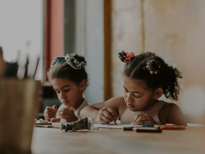 Children drawing a desk