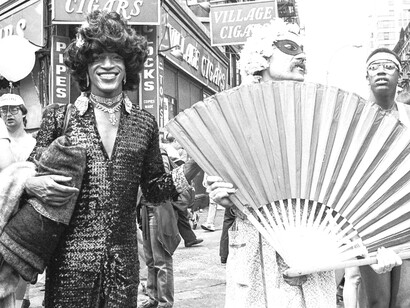 Marsha P. Johnson (left, in dark dress) attending a Gay Pride parade in New York City in 1982