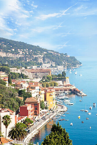 Villefranche-sur-Mer filled with boats off the shoreline, in the Provence-Alpes-Côte d'Azur region on the French Riviera, France