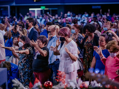 People gathered inside a church, reflecting a modern society where faith continues to shape public life