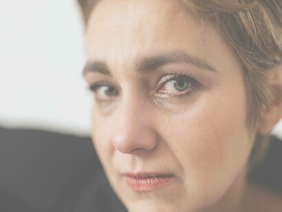 Woman crying and shedding tears