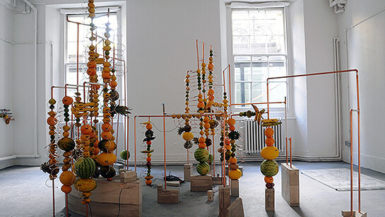 Jeehee Park, fruit battery, 2014. Copper pipes, concrete, fruits, copper clips, zinc plate, variable dimension