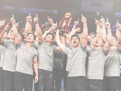 Stanford's NCAA Men's Gymnastic team lifting up the deserved winner's trophy