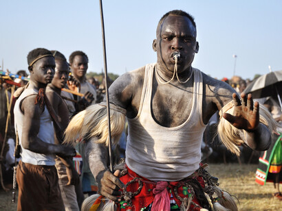 Enikö Nagy, A Ngolo-Nuba man challenges rivals at a suraa bout, an ancient wrestling tradition. 
In Fama, Nuba Mountains 