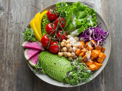 A bowl of healthy and delicious vegetables with a light salad dressing is the best for a clean eating life