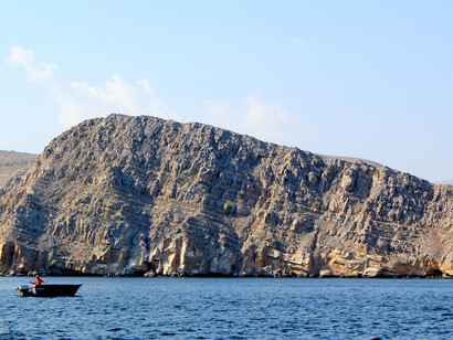 Musandam’s fjords were shaped by the tectonic uplift of the Hajar Mountains, erosion, and sea-level rise that flooded ancient valleys
