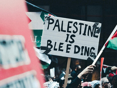 A sign denouncing the atrocities taking place in Gaza