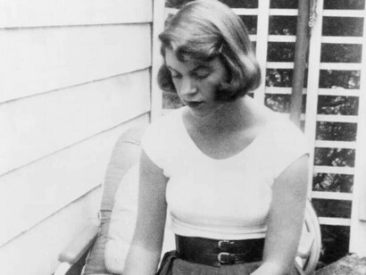 Sylvia Plath author of "The Bell Jar" looking down at the ground
