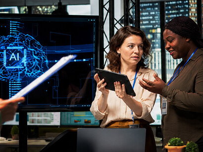 A diverse team of professionals integrating artificial intelligence into their daily work processes
