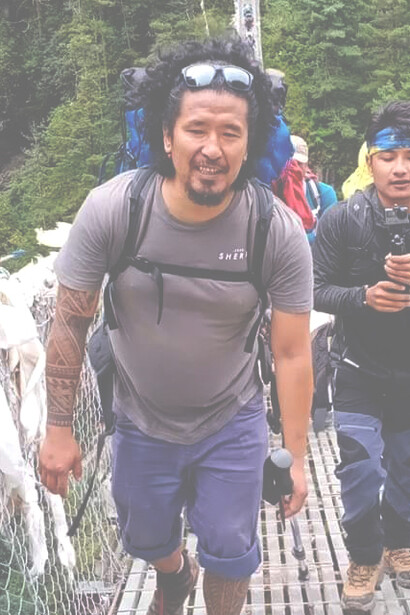 Wangda Sherpa crossing the hanging bridge enroute to Everest Base Camp