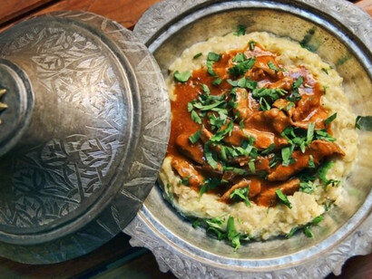 A delectable Hünkar Beğendi, resplendent in all its glory, elegantly presented on a traditional platter