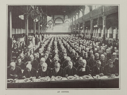 Men at dinner in St Marylebone Workhouse, London, c1900. Photograph published in Living London (Cassell, 1901). Credit: Geffrye Museum of the Home