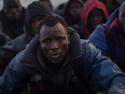 Moment captured during a migration crisis with people on a boat