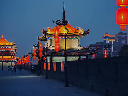 Witness the enchanting spectacle of the illuminated ancient Xian city wall during a captivating evening in China