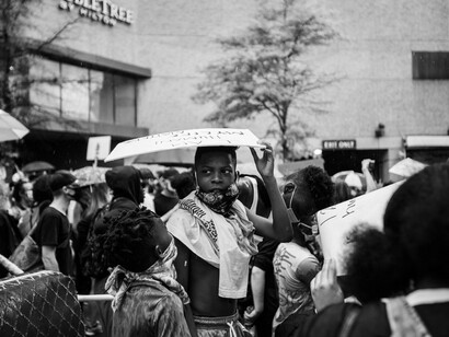 People protesting near a building on the streets of Nashville, closely watched by police during a Black Lives Matter demonstration on June 4, 2020, USA