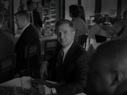 A baby boomer thinking about his next staff hire wondering if they would help ease the succession process