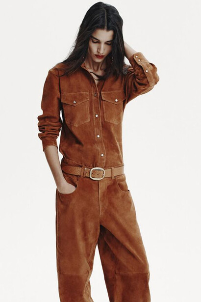 Western-inspired looks from Isabel Marant’s 2025 collection are presented on the runway by a model