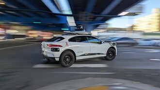 A sleek Waymo robotaxi cruises through San Francisco, symbolizing the city’s leap into an autonomous driving future