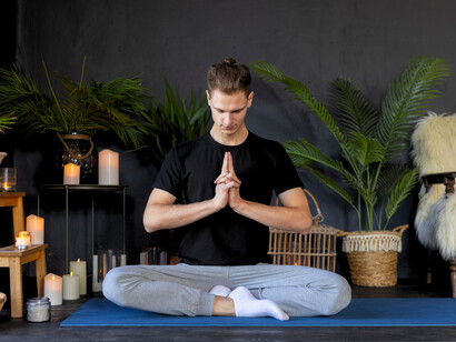 A man immersed in mindfulness through meditation, highlighting the importance of gently retraining a restless mind