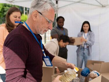 A team of people at a food bank, showcasing how acts of kindness can spark a ripple effect of positive change