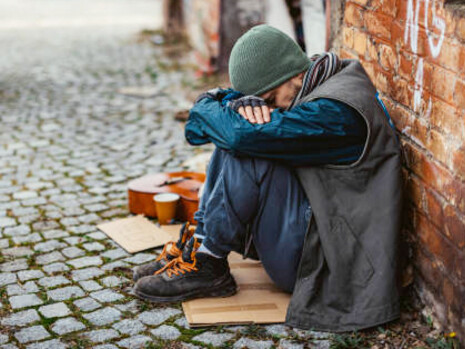 Desperate man living on the street, a stark representation of poverty and health disparities