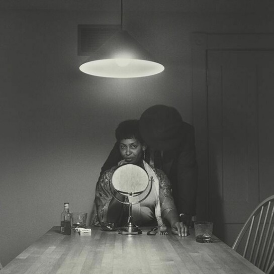 Carrie Mae Weems, Untitled (Man and mirror) (from Kitchen Table Series), 1990, Gelatin silver print, 27 1/4 x 27 1/4 inches (69.2 x 69.2 cm), Collection of Eric and Liz Lefkofsky, Promised gift to The Art Institute of Chicago © Carrie Mae Weems. Photo: © The Art Institute of Chicago