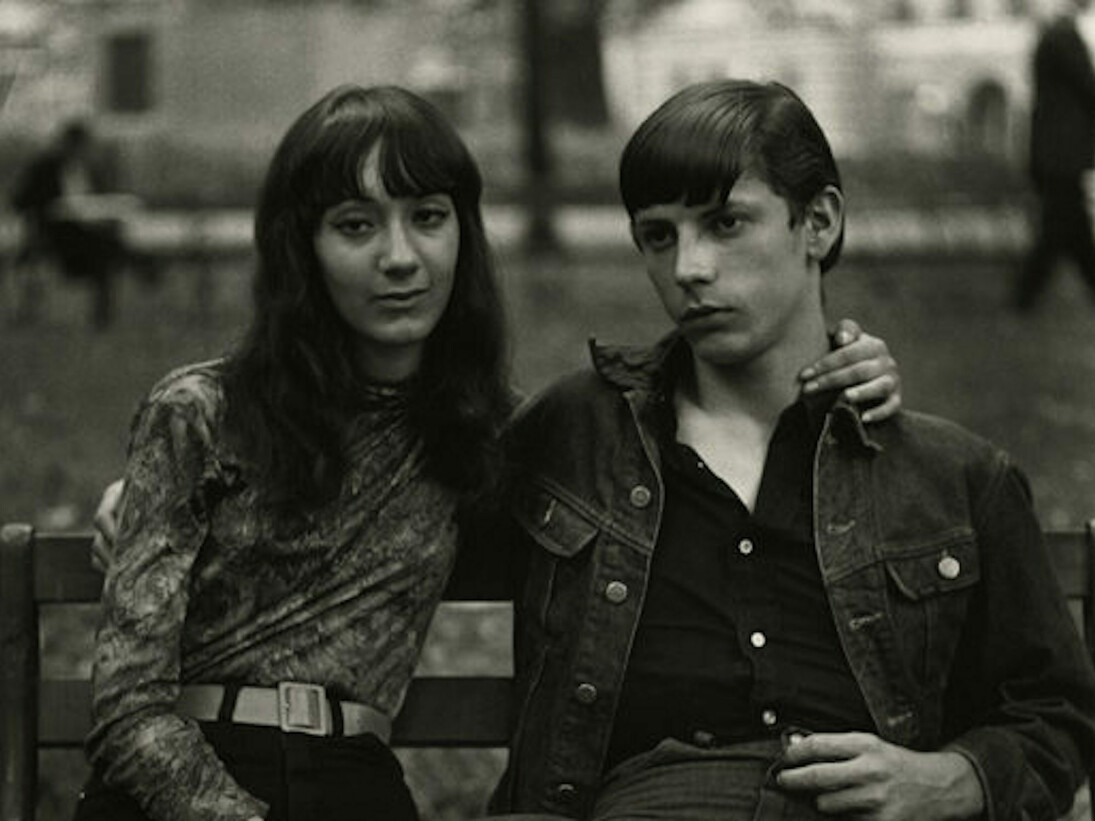 Diane Arbus, Young Couple on a Bench in Washington Square Park, N.Y.C., 1965, Gelatin siver print, Framed: 24 1/2 x 24 1/2 inches (62.2 x 62.2 cm). Courtesy of David Zwirner

