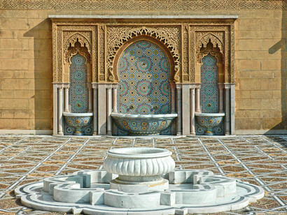 An elegant stone fountain gleaming under sunlight, expressing the grace of craftsmanship in Rabat, Morocco