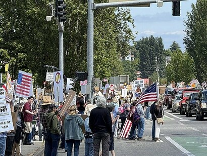From sidewalks to intersections, people i the U.S. marched to defend democracy from creeping authoritarianism
