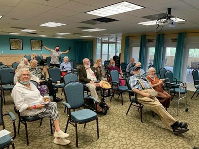 Wowzitude members in conference hall