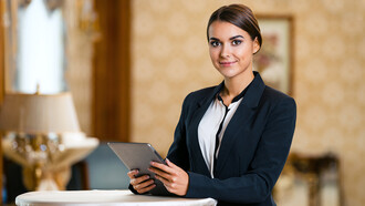 A woman working in the hospitality and tourism sector overseas