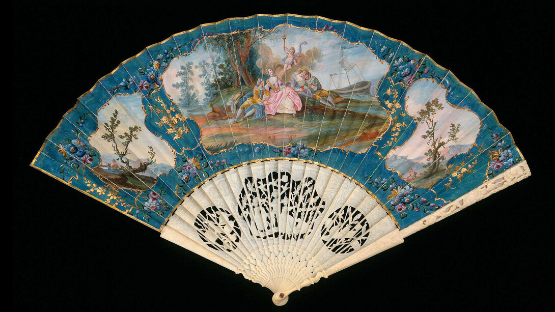 Folding fan, French Or English, 1760S. Skin leaf painted in gouache and gilded; pierced and carved ivory sticks with applied mother-of-pearl. Gift of Miss Annie Jewett.
