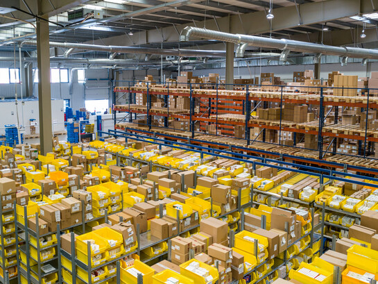 Thousands of boxes inside a warehouse, where the employees organize and manage a magnificent amount of products