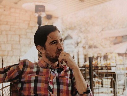 Hand to mouth in a pensive pose is an indication that someone is in deep contemplation about the uncertainties that are present and in the moment 