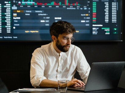 An investor analyzing stock charts, reflecting SpaceX's Nasdaq-100 milestone