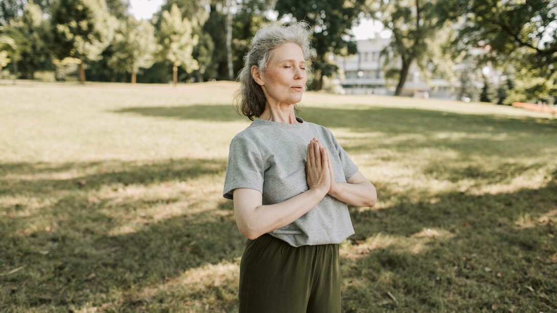Woman breathing in a meditative pose