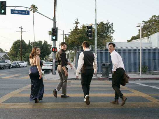 Friends walking together along a walkable city street, capturing a realistic moment of everyday pedestrian life