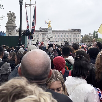 People gathering for coronation day in front of Buckingham Palace, London England