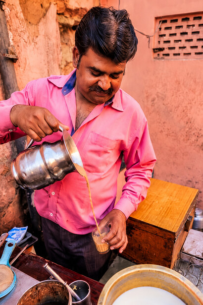 Portrait of a street tea seller preparing fresh chai in India
