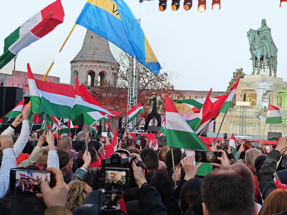People gather in Budapest, Hungary, to celebrate the election results