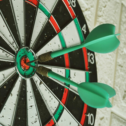 Darts hitting their target 